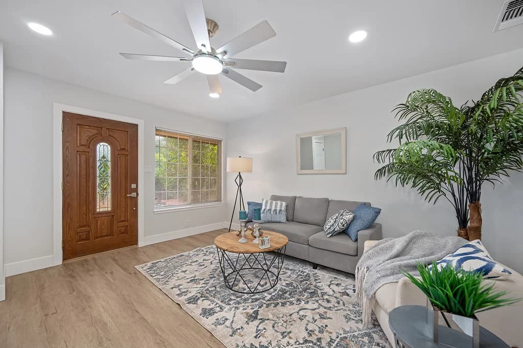 Living room looking toward the front entry at 10229 S White Rock Rd