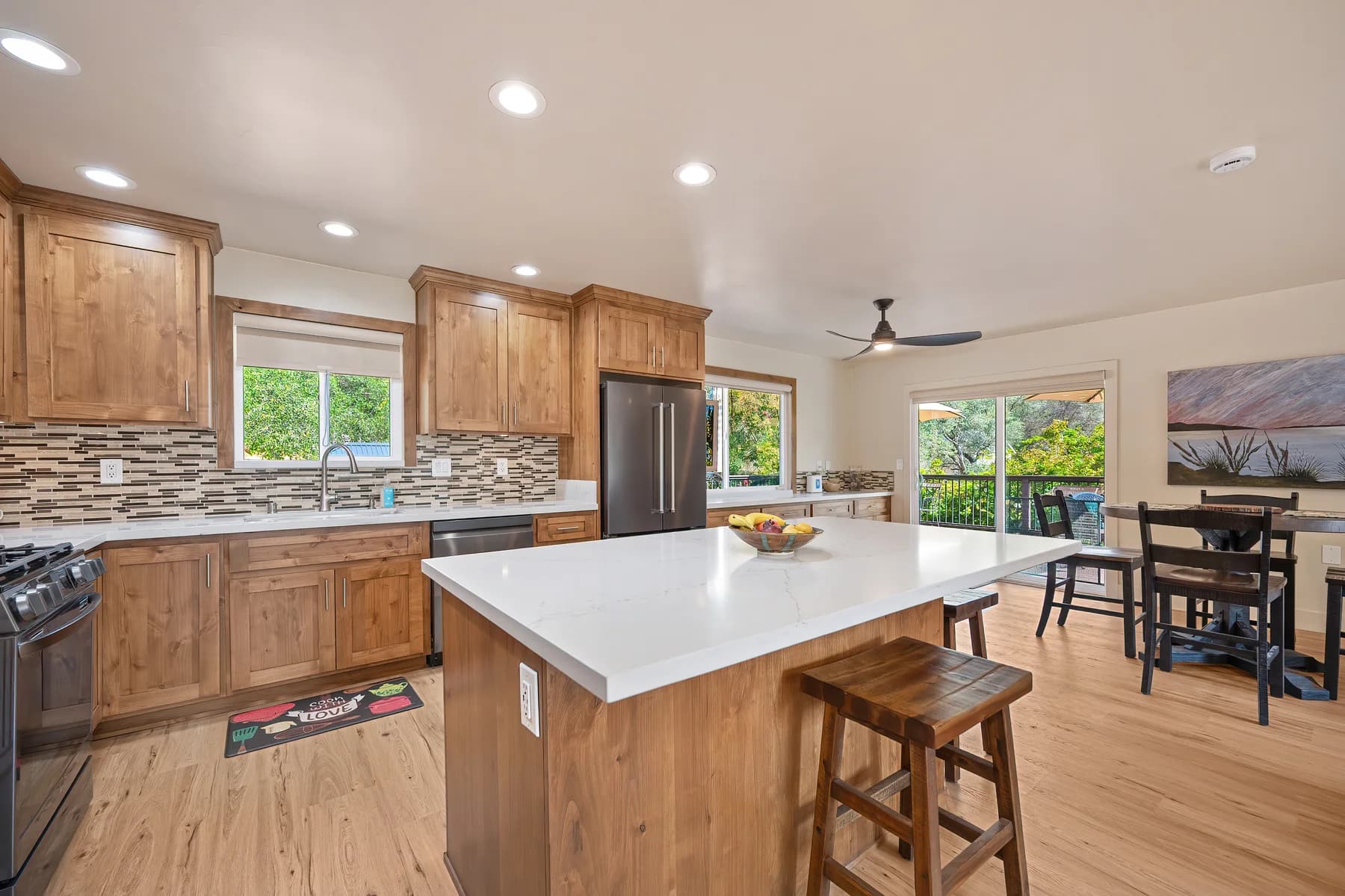 Kitchen island, cabinetry and window above the sink at 153 Russell Rd, Auburn