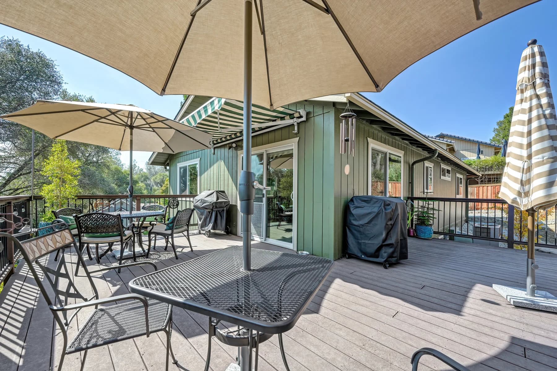 Outdoor table and wraparound porch beside the home at 153 Russell Rd, Auburn