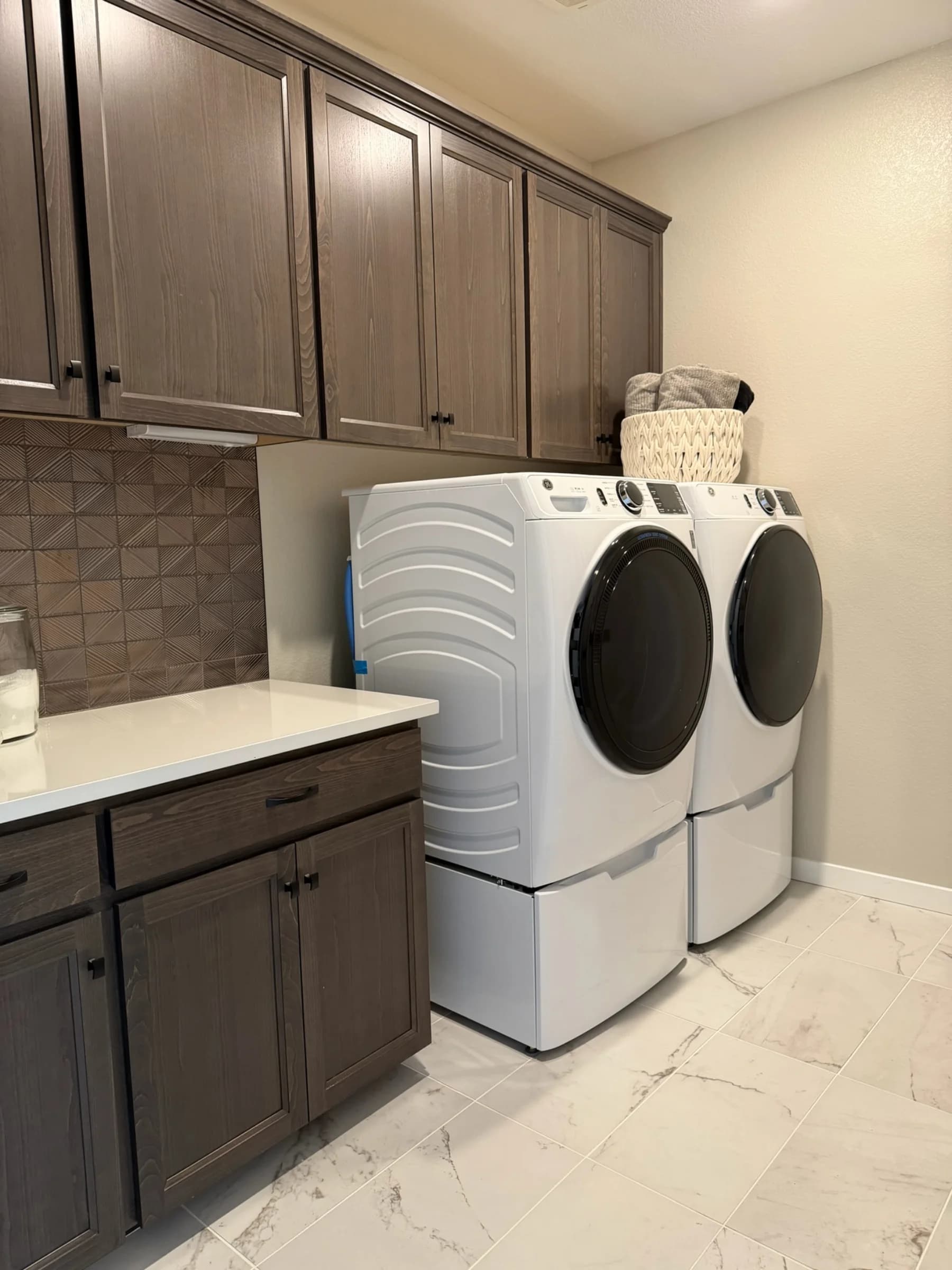 Laundry room in submitted model-home imagery associated with Bloom at Sunridge Park