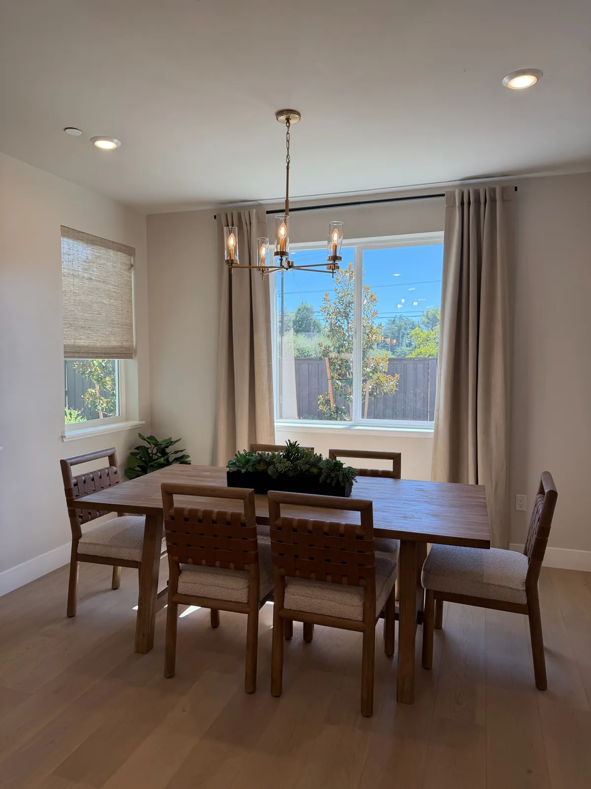 Dining room in a Blossom Ridge model home with large windows