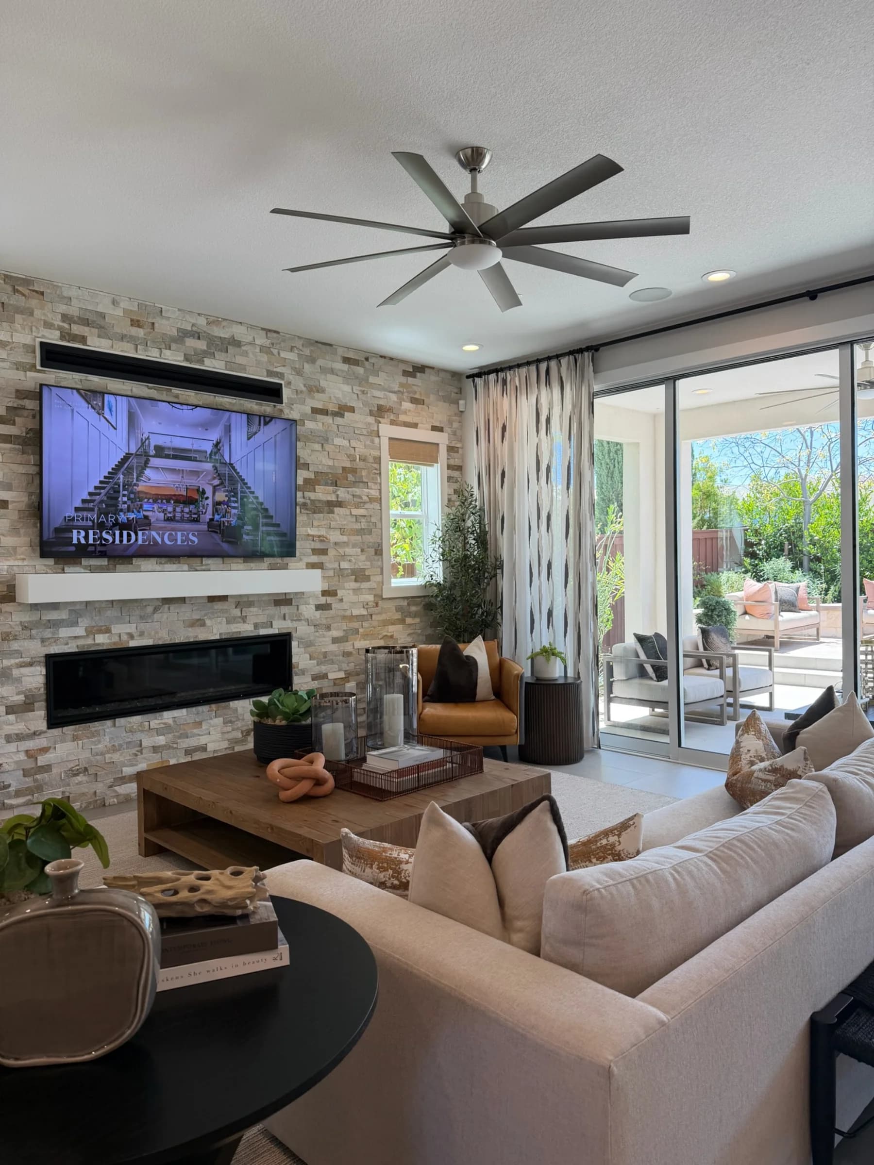 Great room with fireplace in submitted model-home imagery associated with Heritage Trails