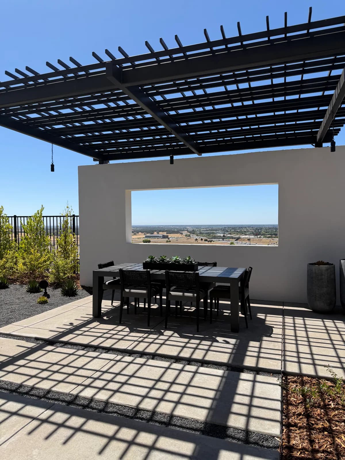 Covered outdoor dining space at a SHAWOOD at Folsom model home