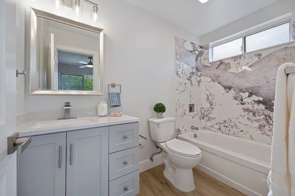 Bathroom vanity and tub surround at 10229 S White Rock Rd